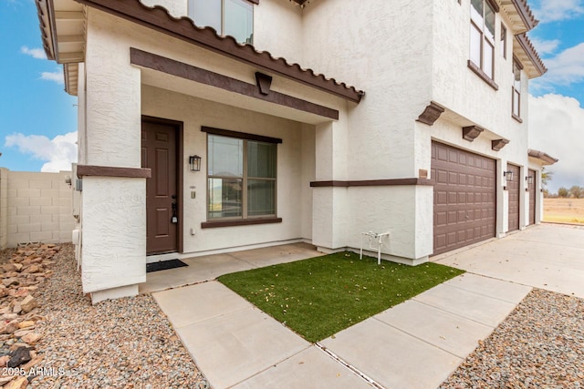 entrance to property featuring a garage