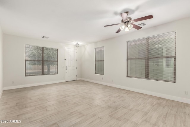 unfurnished room featuring ceiling fan and light hardwood / wood-style floors
