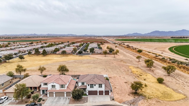 birds eye view of property with a mountain view