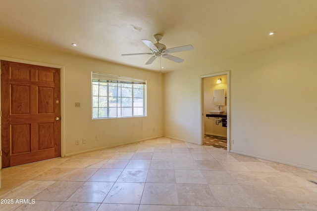 empty room featuring baseboards, a ceiling fan, and recessed lighting