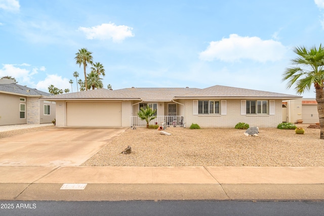 15430 N Bowling Green Dr, Sun City, AZ 85351 - ranch-style house featuring an attached garage, brick siding, and driveway