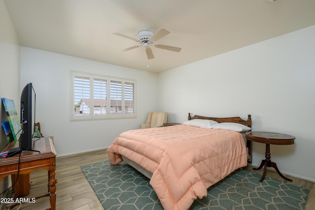 15430 N Bowling Green Dr, Sun City, AZ 85351 - bedroom featuring wood finished floors, baseboards, and ceiling fan