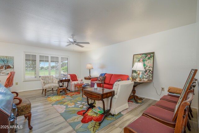 15430 N Bowling Green Dr, Sun City, AZ 85351 - living area with a ceiling fan, baseboards, and wood finished floors