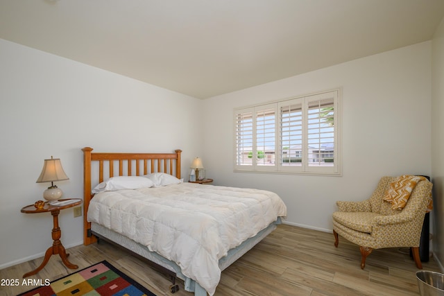 15430 N Bowling Green Dr, Sun City, AZ 85351 - bedroom featuring wood finished floors and baseboards