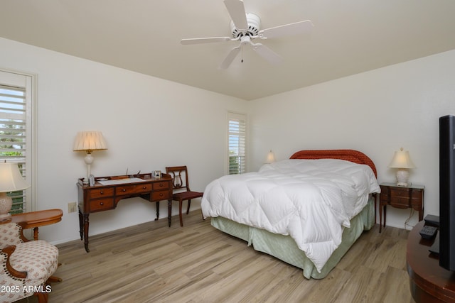 15430 N Bowling Green Dr, Sun City, AZ 85351 - bedroom featuring light wood finished floors and ceiling fan