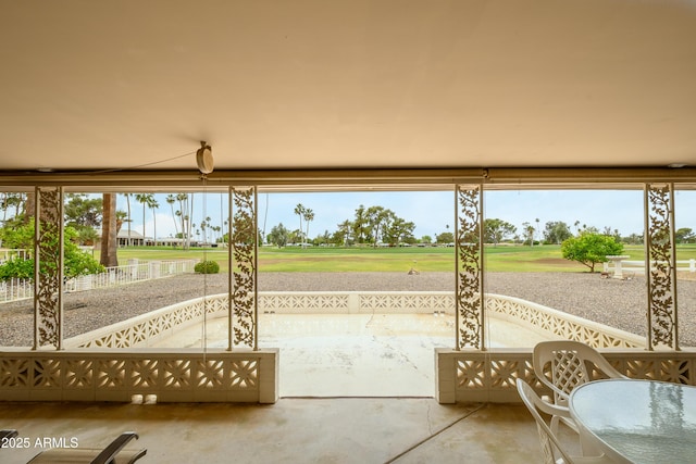 15430 N Bowling Green Dr, Sun City, AZ 85351 - unfurnished sunroom featuring view of golf course