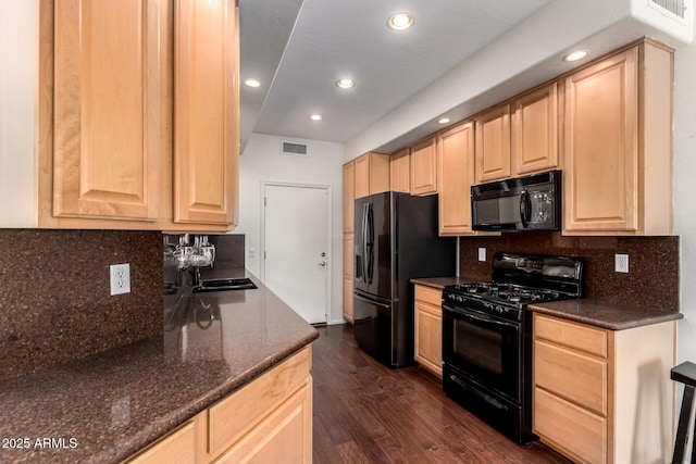 6510 S Hazelton Ln Unit 101, Tempe, AZ 85283 - kitchen with black appliances, light brown cabinets, dark wood-style flooring, backsplash, and recessed lighting