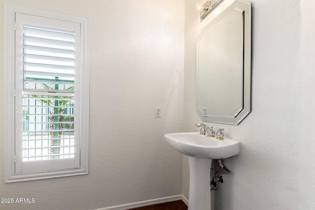 6510 S Hazelton Ln Unit 101, Tempe, AZ 85283 - bathroom featuring baseboards and a sink
