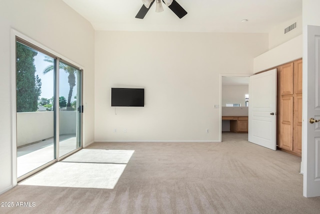 6510 S Hazelton Ln Unit 101, Tempe, AZ 85283 - unfurnished bedroom with access to outside, multiple windows, light carpet, and a ceiling fan