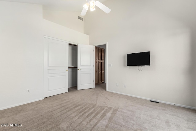 6510 S Hazelton Ln Unit 101, Tempe, AZ 85283 - unfurnished bedroom featuring carpet floors, high vaulted ceiling, a closet, and a ceiling fan