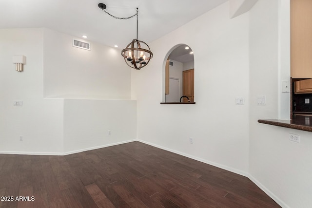 6510 S Hazelton Ln Unit 101, Tempe, AZ 85283 - unfurnished dining area with dark wood-style flooring, a chandelier, and recessed lighting