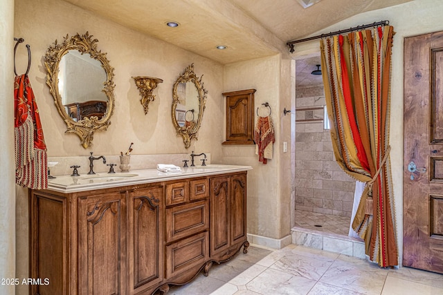 bathroom featuring vanity and a tile shower