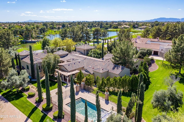 birds eye view of property with a water view