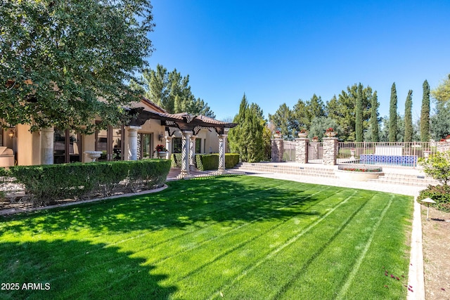 view of yard with a pool and a pergola