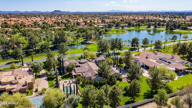 birds eye view of property featuring a water and mountain view