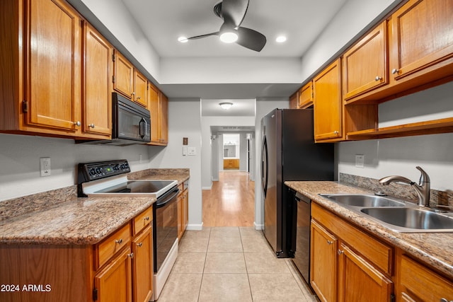 kitchen featuring dishwasher, sink, ceiling fan, light tile patterned floors, and white electric range oven