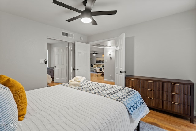 bedroom featuring light wood-style floors and ceiling fan