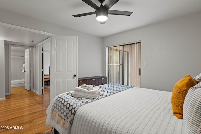 bedroom featuring wood finished floors, baseboards, and ceiling fan