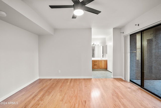 unfurnished bedroom with access to exterior, light hardwood / wood-style flooring, ensuite bath, and ceiling fan