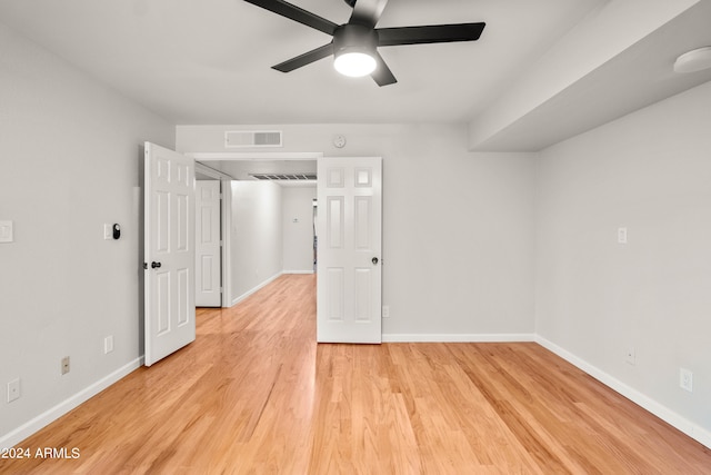 unfurnished room featuring ceiling fan and light hardwood / wood-style flooring