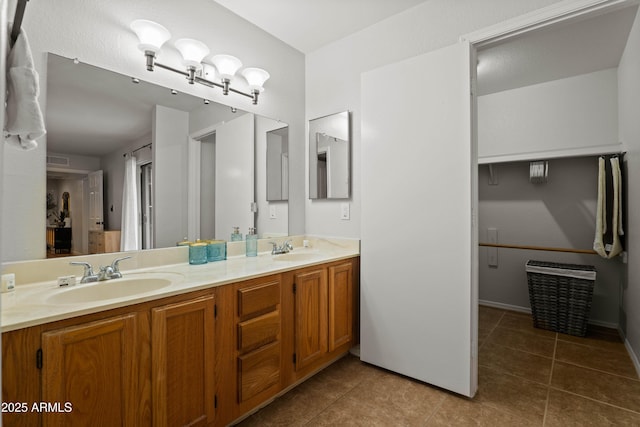 bathroom featuring tile patterned flooring and double vanity