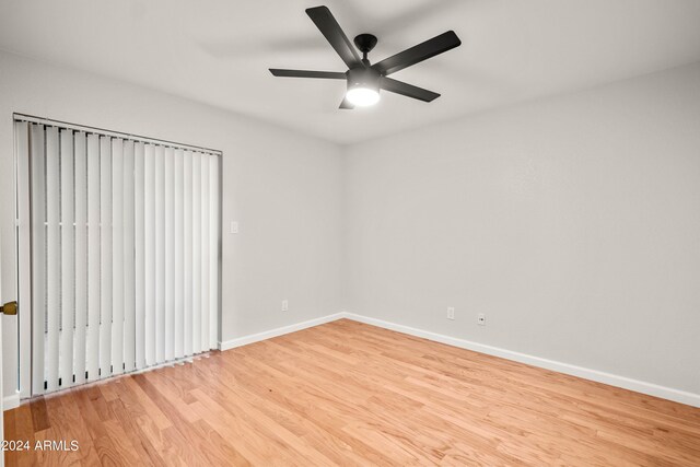 unfurnished room with ceiling fan and light hardwood / wood-style flooring