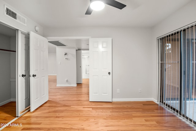 interior space with ceiling fan and light hardwood / wood-style flooring