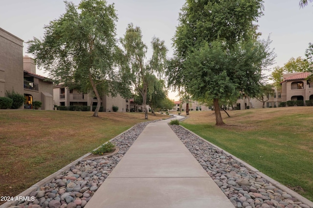 surrounding community with a yard