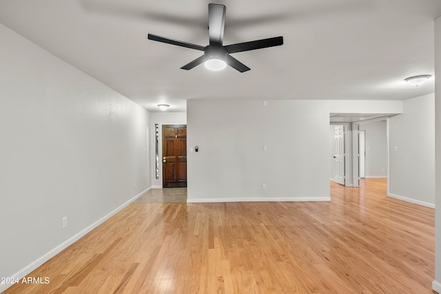 empty room with light hardwood / wood-style flooring and ceiling fan