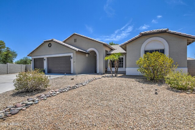 ranch-style house featuring a garage