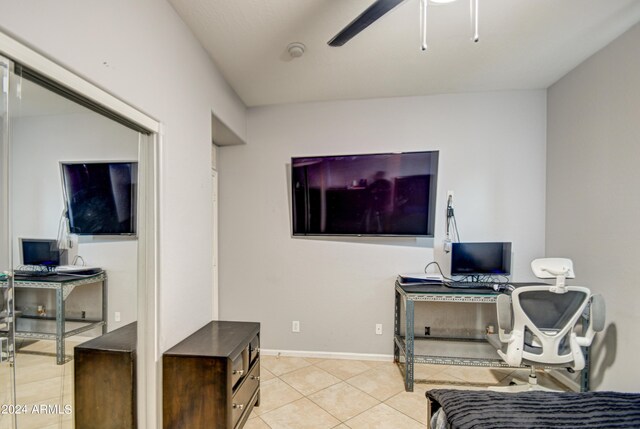 office space featuring ceiling fan and light tile patterned floors