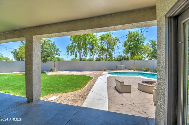 view of patio featuring a fenced in pool