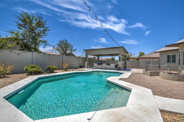 view of swimming pool with a patio area