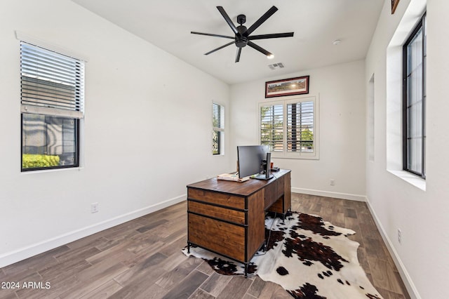 office area with a ceiling fan, baseboards, visible vents, and wood finished floors