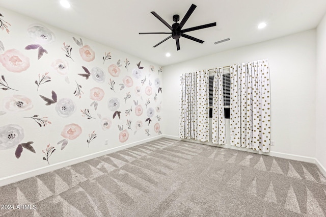 carpeted spare room featuring recessed lighting, visible vents, ceiling fan, and baseboards