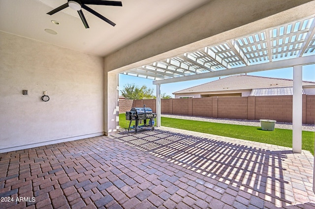 view of patio with a pergola, fence, area for grilling, and ceiling fan