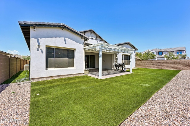 rear view of house with a patio area, a fenced backyard, a lawn, and a pergola