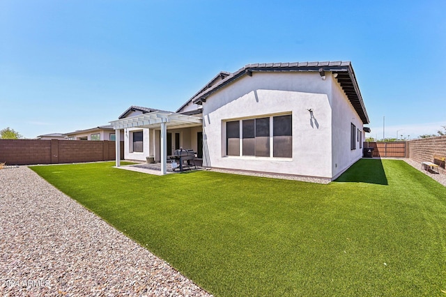 back of property featuring a patio, stucco siding, a lawn, a pergola, and a fenced backyard