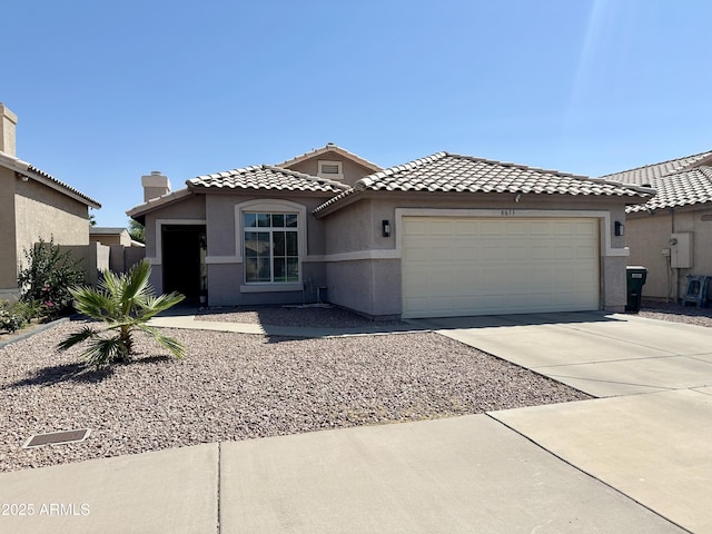 8673 W Palm Ln, Phoenix, AZ 85037 - mediterranean / spanish house with a garage, stucco siding, driveway, a tiled roof, and a chimney