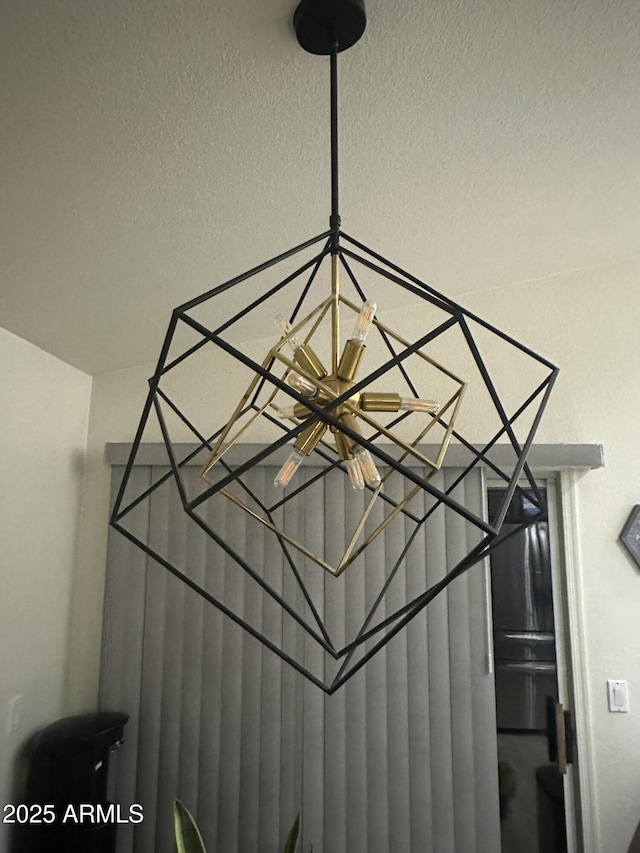 8673 W Palm Ln, Phoenix, AZ 85037 - detailed view of a textured ceiling and a chandelier