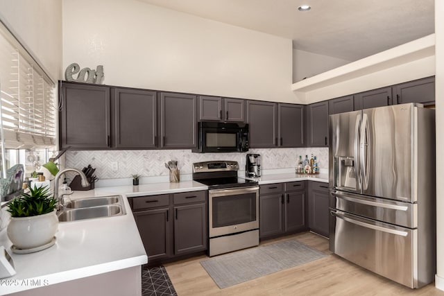 8673 W Palm Ln, Phoenix, AZ 85037 - kitchen with stainless steel appliances, light countertops, tasteful backsplash, and recessed lighting