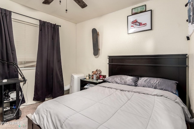 8673 W Palm Ln, Phoenix, AZ 85037 - bedroom with carpet floors and ceiling fan
