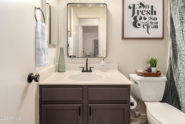 8673 W Palm Ln, Phoenix, AZ 85037 - bathroom with toilet and vanity