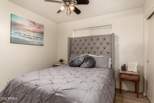 8673 W Palm Ln, Phoenix, AZ 85037 - bedroom featuring wood finished floors and a ceiling fan