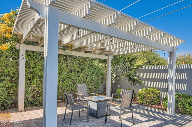 view of patio with a pergola and an outdoor fire pit