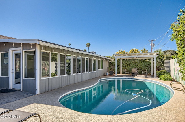 view of pool with a pergola and a patio