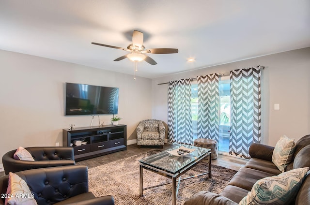 living room featuring ceiling fan and hardwood / wood-style floors