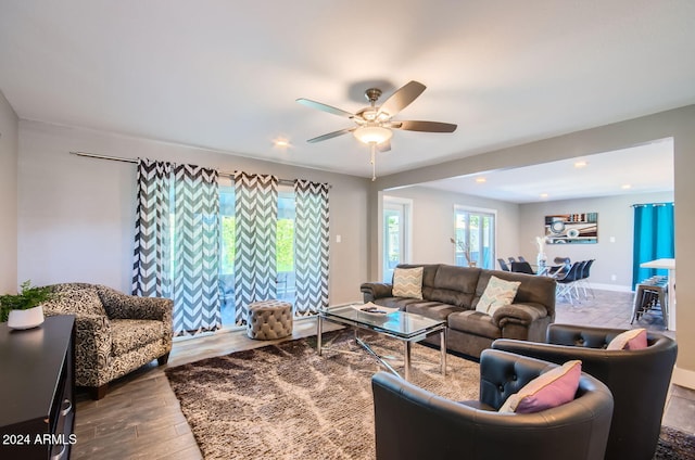 living room featuring hardwood / wood-style flooring and ceiling fan