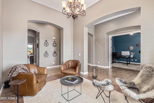 2255 N Hillridge, Mesa, AZ 85207 - living room with arched walkways, a chandelier, and baseboards