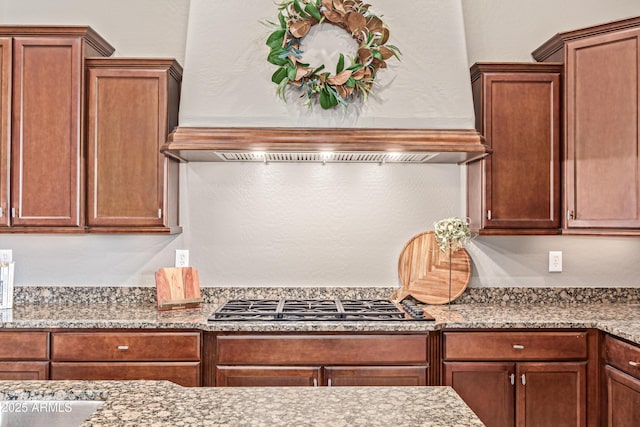 2255 N Hillridge, Mesa, AZ 85207 - kitchen with stainless steel gas stovetop, premium range hood, and light stone counters